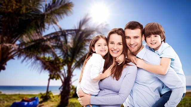 Father and mother playing with their kids