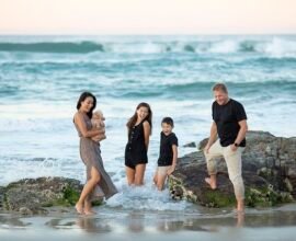 FATHER AND MOTHER PLAYING WITH KIDS OM SEA SITE