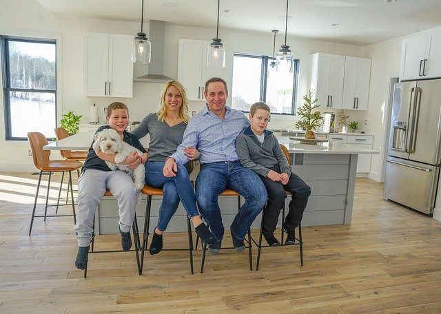 FATHER AND MOTHER ENJOYING WITH KIDS ON DINING TABLE