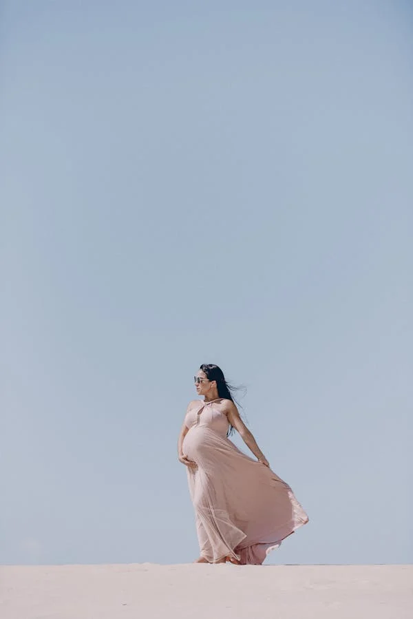 A PREGNANT WOMAN ENJOYING FRESH AIR