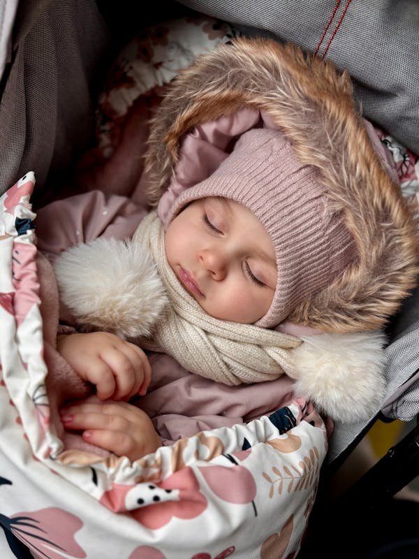 A CUTE BABY ENJOYING NAP