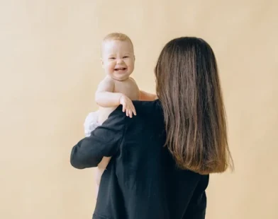 A WOMAN HOLDING HER NEW BORN BABY