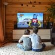 Two kids watching tv