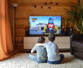 Two kids watching tv