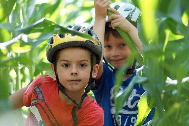 TWOBOYS PLAING IN FOREST WITH A GREAT CONFIDENCE