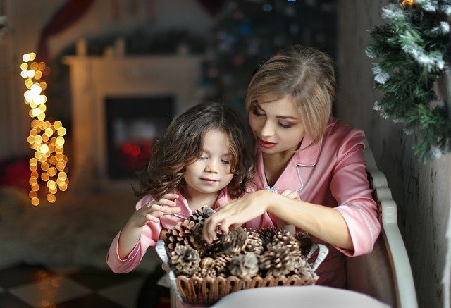 A mother loving her daughter and teaching .