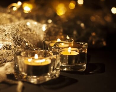 TWO CANDLES SHINING ON THE DINING TABLE FOR A PARENTS NIGHT OUT