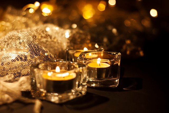 TWO CANDLES SHINING ON THE DINING TABLE FOR A PARENTS NIGHT OUT