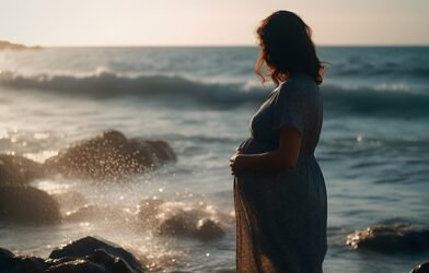 A PREGNANT WOMAN ENJOYING SEA SITE