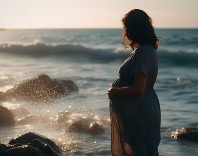 A PREGNANT WOMAN ENJOYING SEA SITE