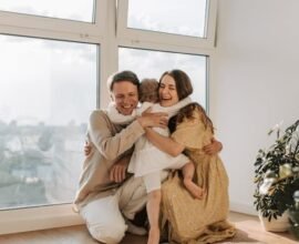 FATHER AND MOTHER LOVING THEIR CHILD