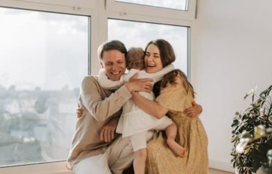 FATHER AND MOTHER LOVING THEIR CHILD