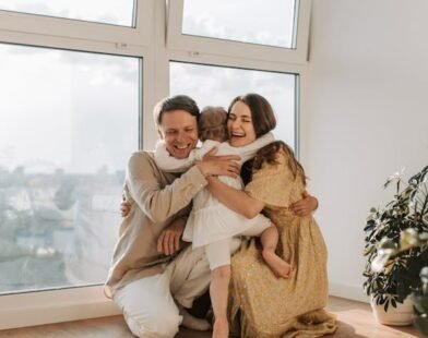 FATHER AND MOTHER LOVING THEIR CHILD
